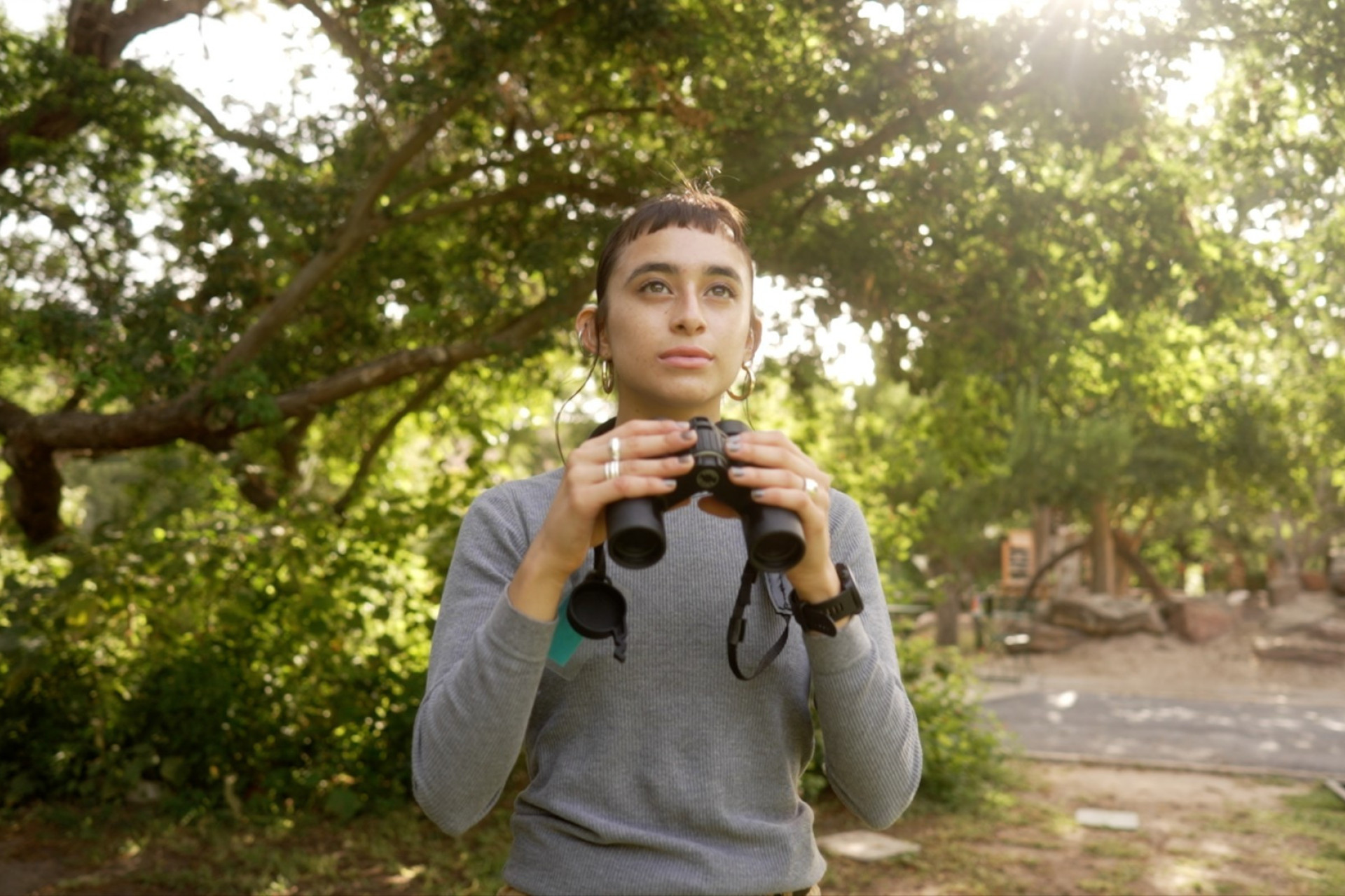 A woman using binoculars